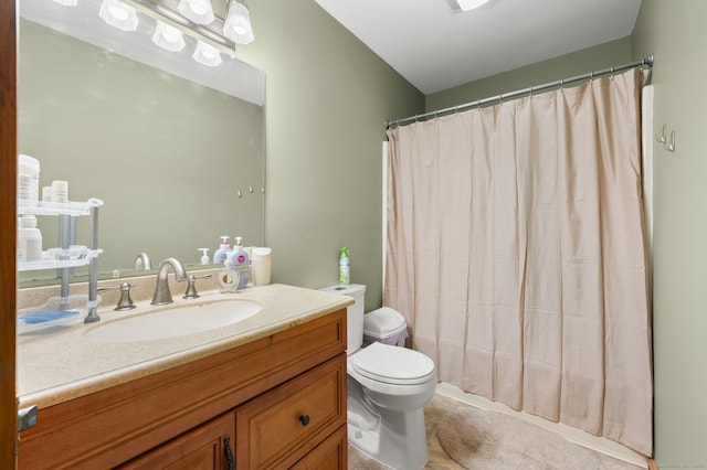 full bathroom with vanity, a shower with curtain, and toilet