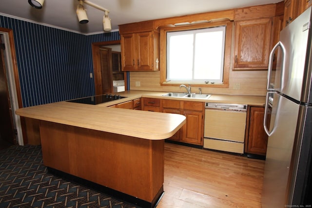 44 Old Plains Rd, Windham, CT 06226 - kitchen featuring black electric stovetop, freestanding refrigerator, dishwasher, a sink, and a peninsula