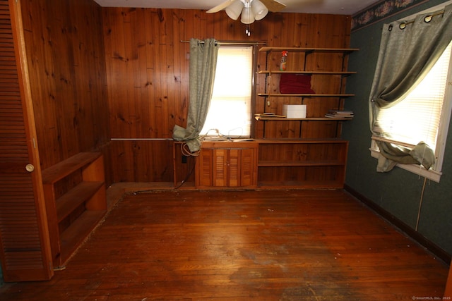 44 Old Plains Rd, Windham, CT 06226 - unfurnished room with wood-type flooring, ceiling fan, and wood walls