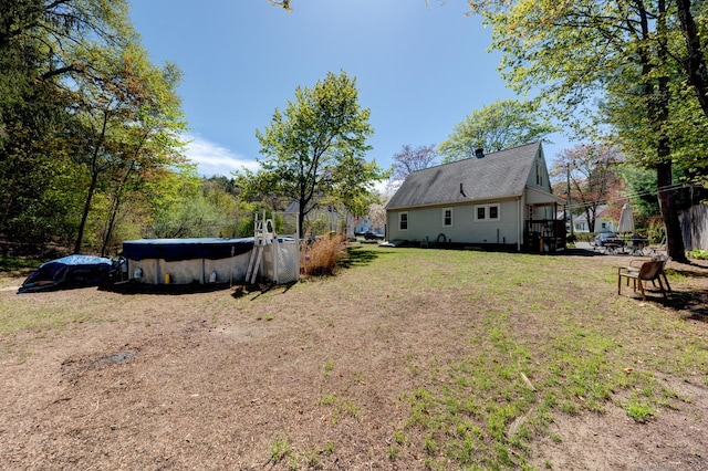 view of yard featuring an outdoor pool
