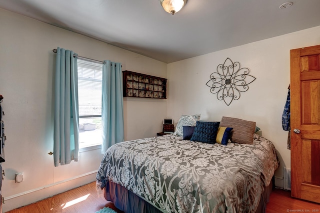 bedroom featuring wood finished floors