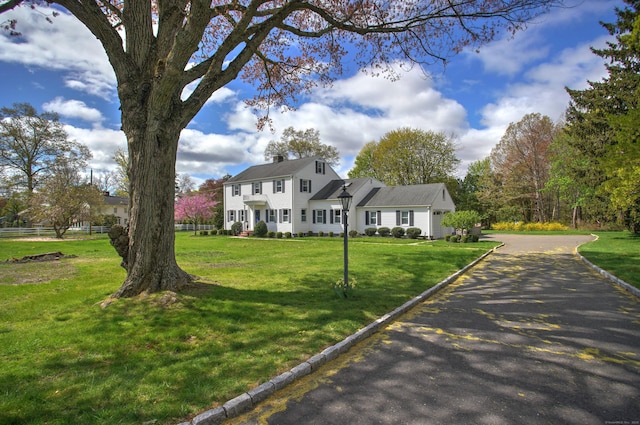 187 Sport Hill Rd, Easton, CT 06612 - colonial house with a front lawn and a chimney