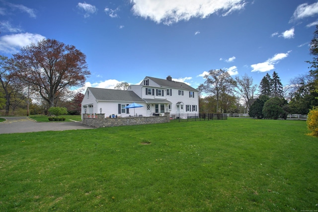 187 Sport Hill Rd, Easton, CT 06612 - exterior space featuring fence, a chimney, driveway, and a front lawn