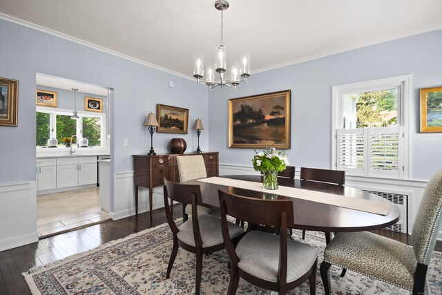 187 Sport Hill Rd, Easton, CT 06612 - dining area with crown molding, a notable chandelier, wainscoting, and light wood finished floors