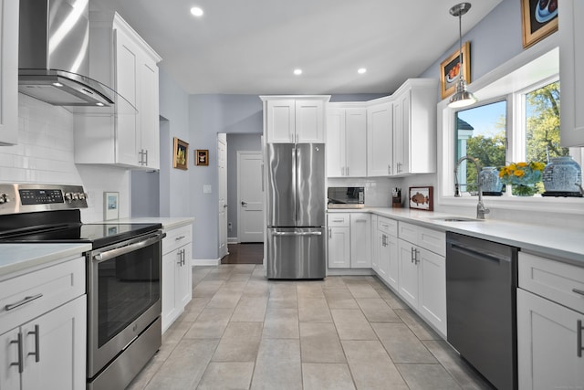 187 Sport Hill Rd, Easton, CT 06612 - kitchen with decorative backsplash, appliances with stainless steel finishes, a sink, light countertops, and wall chimney exhaust hood
