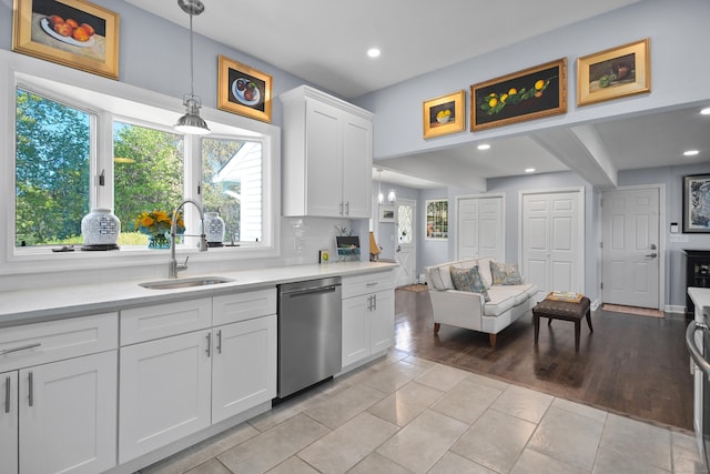 187 Sport Hill Rd, Easton, CT 06612 - kitchen with a sink, light countertops, stainless steel dishwasher, and open floor plan