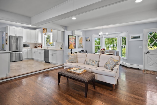 187 Sport Hill Rd, Easton, CT 06612 - living area with a baseboard heating unit, recessed lighting, light wood-style flooring, and a notable chandelier