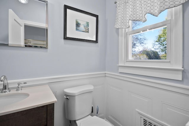 187 Sport Hill Rd, Easton, CT 06612 - bathroom featuring wainscoting, a decorative wall, vanity, toilet, and visible vents