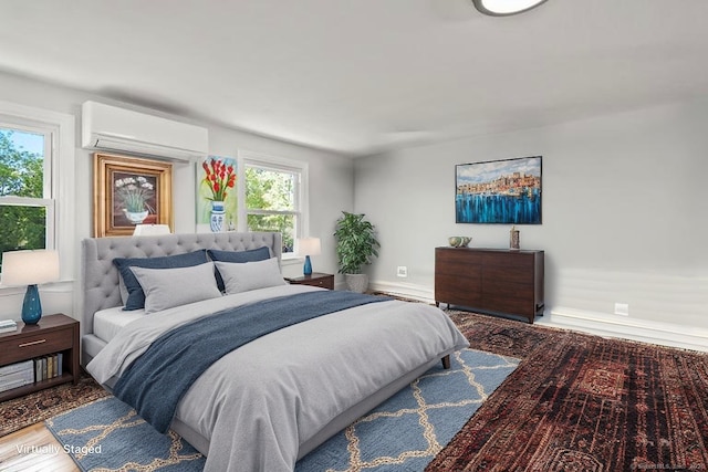 187 Sport Hill Rd, Easton, CT 06612 - bedroom featuring an AC wall unit, baseboards, a baseboard heating unit, and wood finished floors