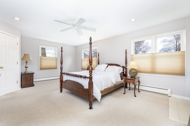 carpeted bedroom featuring recessed lighting, baseboards, and a baseboard heating unit
