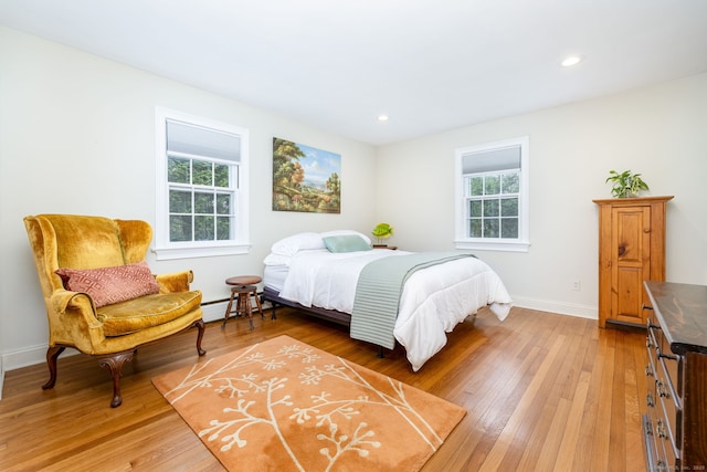 bedroom featuring recessed lighting, baseboards, and light wood finished floors