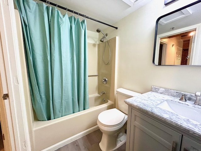 bathroom featuring toilet, vanity, shower / bath combination with curtain, and wood finished floors