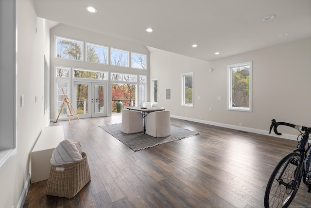living area with french doors, recessed lighting, dark wood finished floors, and baseboards