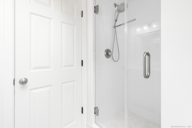 full bathroom featuring a shower stall
