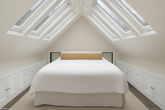 bedroom with lofted ceiling with skylight