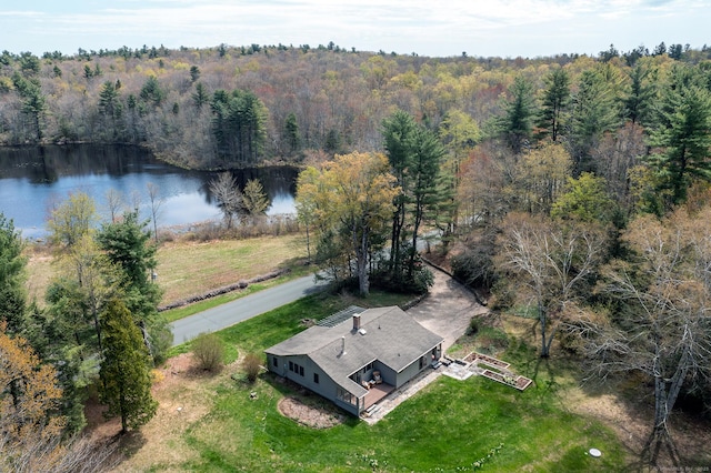 aerial view with a water view and a wooded view