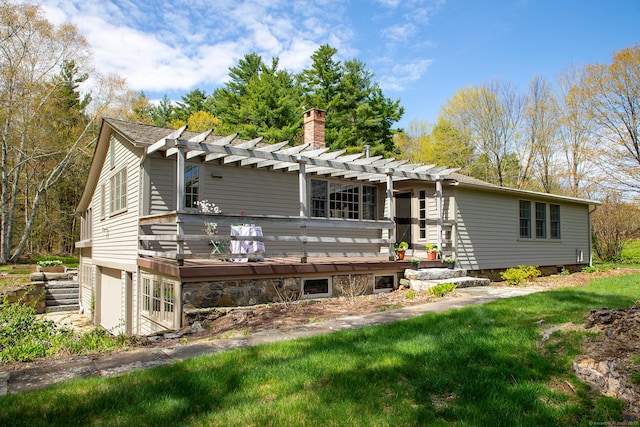 view of front facade with a wooden deck, a pergola, and a chimney