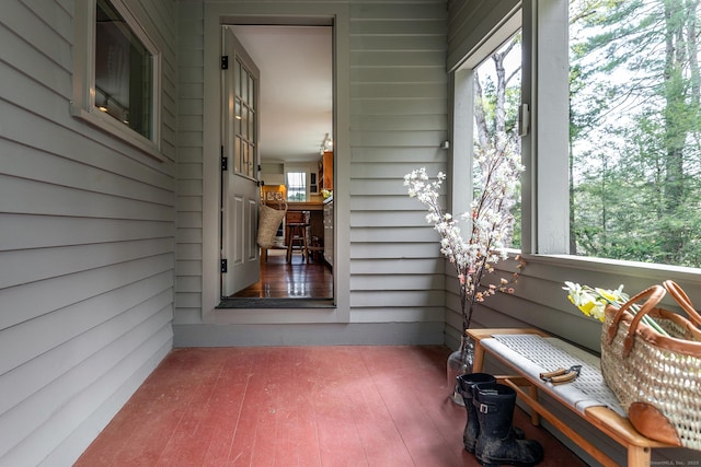 sunroom / solarium featuring a healthy amount of sunlight