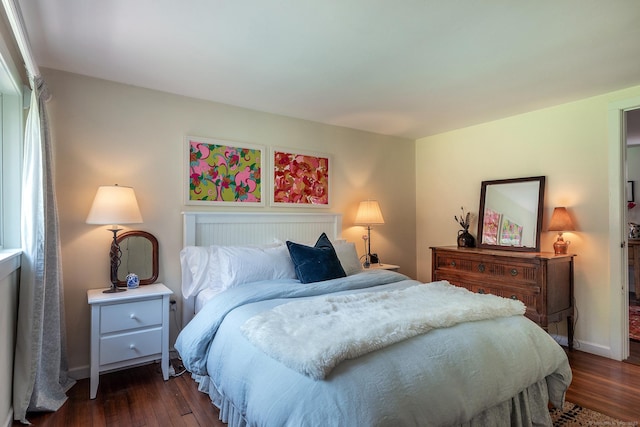 bedroom featuring dark wood-type flooring