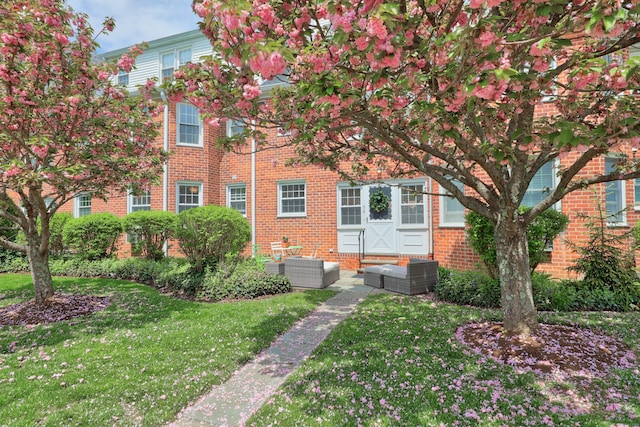 56 Putnam Park, Greenwich, CT 06830 - rear view of property featuring an outdoor living space, a lawn, and brick siding
