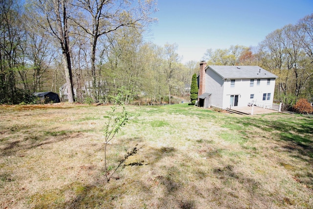view of yard featuring a wooden deck