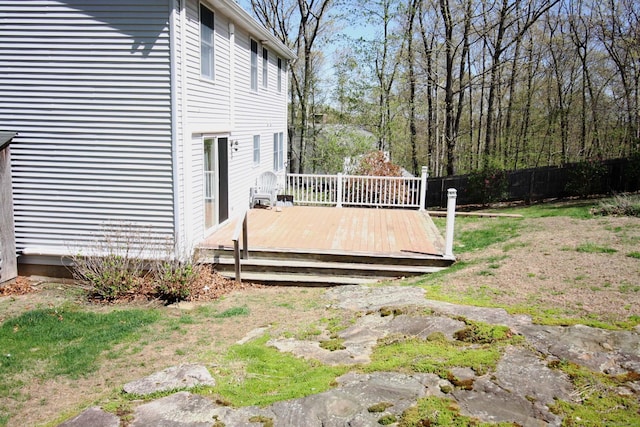 view of yard featuring fence and a deck