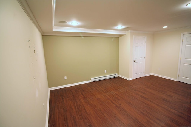 below grade area featuring baseboards, a baseboard heating unit, dark wood-style floors, ornamental molding, and recessed lighting