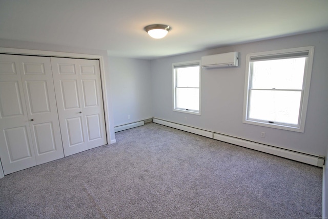 unfurnished bedroom with an AC wall unit, light colored carpet, a closet, and a baseboard radiator