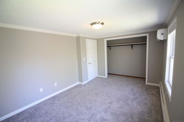unfurnished bedroom with carpet flooring, baseboards, ornamental molding, and a closet