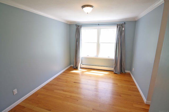 unfurnished room with light wood-style floors, baseboards, a baseboard radiator, and ornamental molding