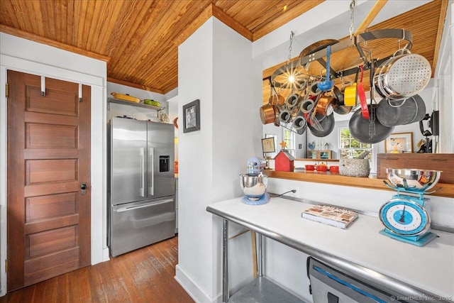 kitchen featuring ornamental molding, wood finished floors, baseboards, stainless steel refrigerator with ice dispenser, and wood ceiling