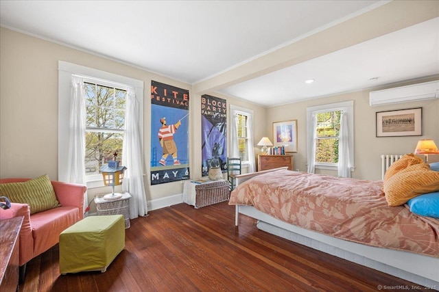 bedroom with multiple windows, ornamental molding, and dark wood finished floors