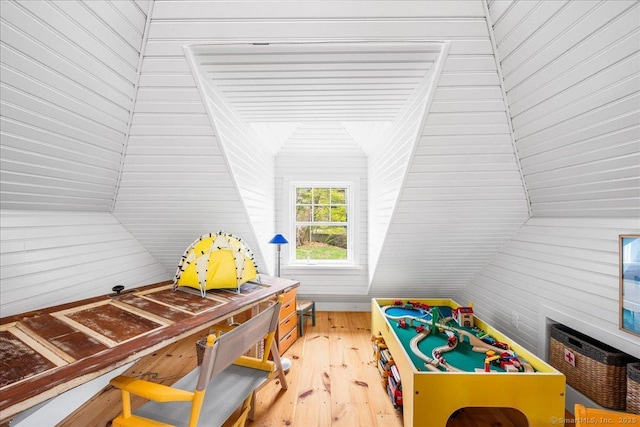 recreation room featuring lofted ceiling and light wood-style floors