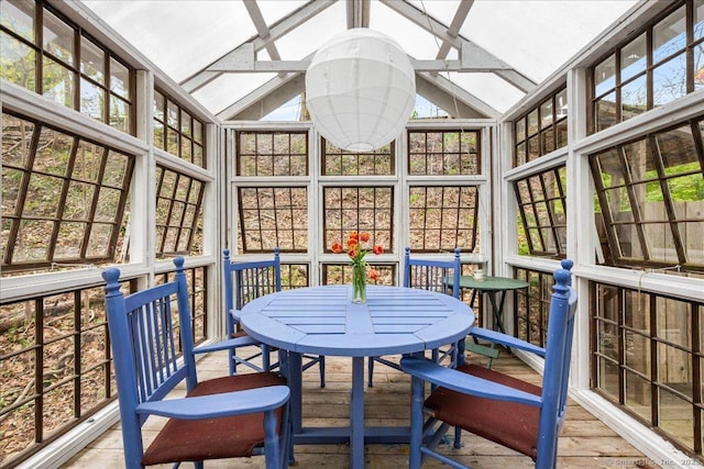 sunroom with outdoor dining area