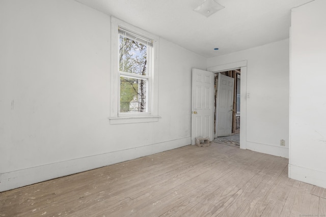 unfurnished bedroom featuring wood finished floors