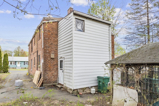 view of side of property featuring a chimney