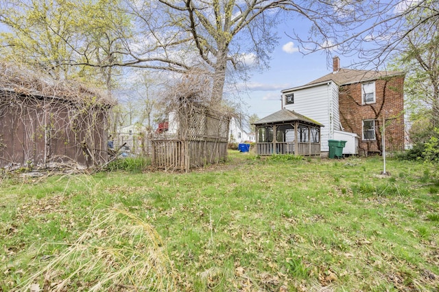 view of yard featuring a gazebo and fence