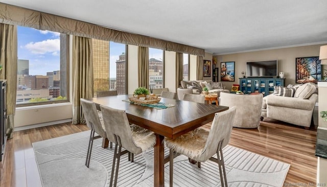 1 Gold St Unit 17De, Hartford, CT 06103 - dining space with wood finished floors, crown molding, and a city view