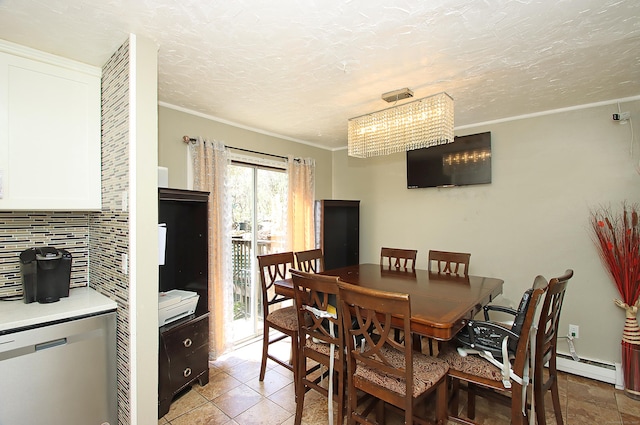 dining room with crown molding, a textured ceiling, and baseboard heating