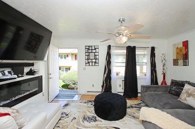 living room featuring ceiling fan, wood finished floors, and baseboard heating