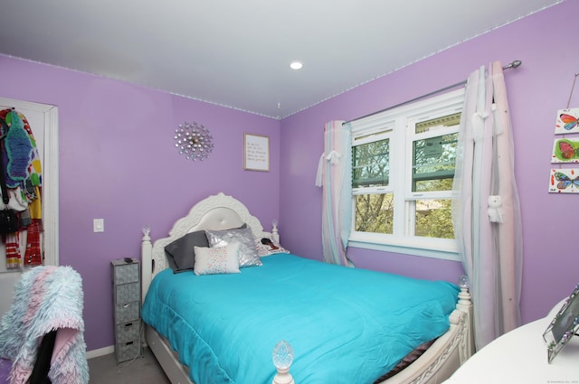 bedroom featuring baseboards and recessed lighting