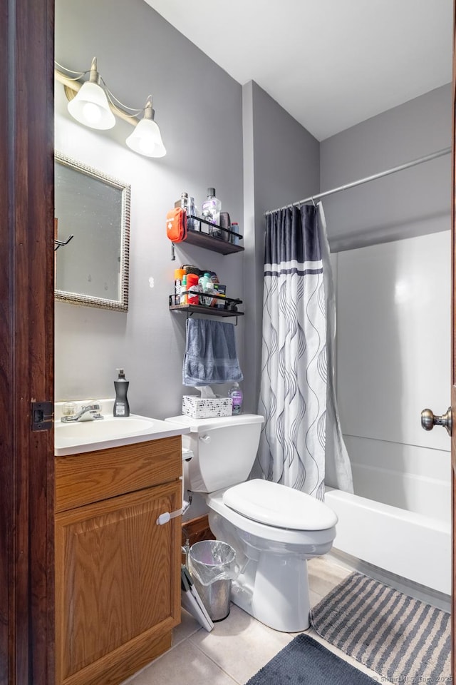 full bath with shower / tub combo with curtain, toilet, tile patterned flooring, and vanity