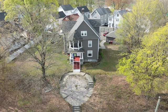 birds eye view of property with a residential view