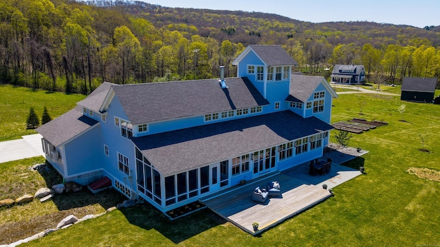 bird's eye view featuring a forest view