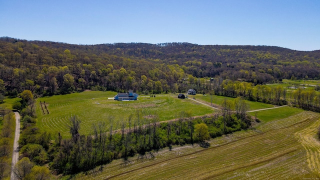 drone / aerial view with a forest view and a rural view
