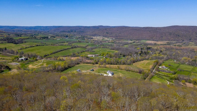 drone / aerial view with a mountain view and a rural view