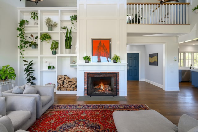 34 Knibloe Hill Rd, Sharon, CT 06069 - living area featuring baseboards, a fireplace with flush hearth, and wood finished floors