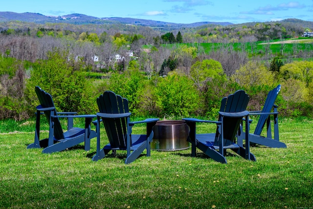 34 Knibloe Hill Rd, Sharon, CT 06069 - view of playground featuring a lawn, a wooded view, a mountain view, and an outdoor fire pit