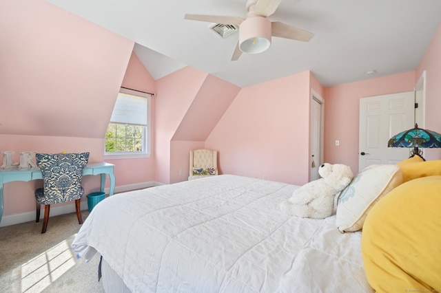 carpeted bedroom featuring ceiling fan, visible vents, baseboards, and vaulted ceiling