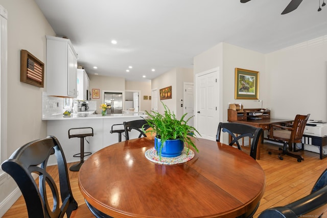 dining space with recessed lighting, ceiling fan, and light wood finished floors